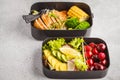 Healthy meal prep containers with grilled chicken with fruits, b