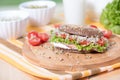 A healthy meal of whole wheat dark brown rye bread, curd cream cheese, radish, alfalfa sprouts, ham, cherry tomatoes salad Royalty Free Stock Photo