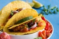 Mexican Tacos with Ground Beef and Vegetables on Rustic Blue Background Royalty Free Stock Photo