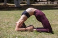 Healthy middle aged woman doing fitness stretching outdoors Royalty Free Stock Photo