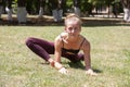 Healthy middle aged woman doing fitness stretching outdoors Royalty Free Stock Photo