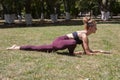 Healthy middle aged woman doing fitness stretching outdoors Royalty Free Stock Photo