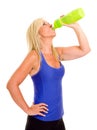 Healthy middle aged woman drinking water