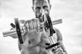 Healthy mind in a healthy body. Muscular man exercising with dumbbell. Dumbbell exercise. Dare to be great. Sportsman Royalty Free Stock Photo