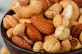 Healthy mix of different nuts in a bowl on a gray concrete or stone background. Almonds, hazelnuts, cashews close up. A Useful Royalty Free Stock Photo