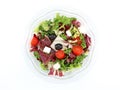 Healthy mixed salad in a transparent bowl. The ingredients are lettuce, radicchio, cherry tomatoes, black olives and soft cheese. Royalty Free Stock Photo