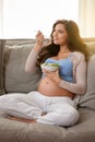 Healthy mom, healthy baby. a pregnant woman eating a healthy salad at home. Royalty Free Stock Photo