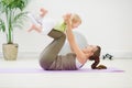 Healthy mother and baby making gymnastics Royalty Free Stock Photo