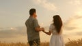 Healthy mother, father farmer and little girl daughter enjoying nature together. Happy young family with a child walking Royalty Free Stock Photo