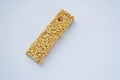 Healthy munchies on white background. cereal bar on a white background