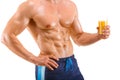 Healthy muscular man holding a glass with juice, shaped abdominal, isolated Royalty Free Stock Photo