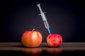 Healthy and mutilated apple. Introduction dose of drugs. Drug addiction. Injection during illness_