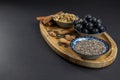 On wooden board, some cinnamon sticks, almonds and sunflower seeds. Royalty Free Stock Photo