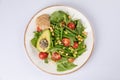 Healthy natural food. Salad with green vegetables, vitamins on the plate Royalty Free Stock Photo