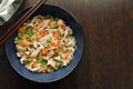 Healthy noodles with pork and vegetables in a bowl.