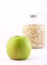 Healthy nourishment: oat flakes and green apple Royalty Free Stock Photo