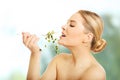 Healthy nude woman eating cuckooflower Royalty Free Stock Photo
