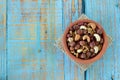 Healthy nut mix in a bowl on a rustic wooden background with copy space Royalty Free Stock Photo