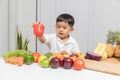 Healthy and nutrition concept. Kid learning about nutrition to choose how to eat fresh fruits and vegetables Royalty Free Stock Photo