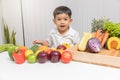 Healthy and nutrition concept. Kid learning about nutrition to choose how to eat fresh fruits and vegetables. Royalty Free Stock Photo