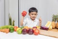 Healthy and nutrition concept. Kid learning about nutrition to choose how to eat fresh fruits and vegetables Royalty Free Stock Photo