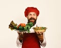 Healthy nutrition and cuisine concept. Chef holds potato and vegetables