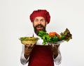 Healthy nutrition and cuisine concept. Chef holds potato and vegetables