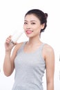 Healthy nutrition. Happy young asian woman drinking milk Royalty Free Stock Photo