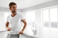 Healthy Nutrition. Man Drinking Glass Of Fresh Water In Morning Royalty Free Stock Photo