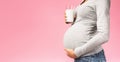 Healthy nutrition. Unrecognizable pregnant woman with glass of milk Royalty Free Stock Photo