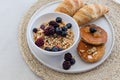 Healthy breakfast concept. Granola with berries, croissants and pancakes Royalty Free Stock Photo