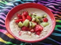 Healthy nutritious fruity breakfast on colorful zebra blanket