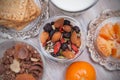 Healthy Nuts and Dried Fruits on Rustic Wooden Background. Glass of Milk, Biscuits and Biscuits. Wooden Honney Spoon. Top view.