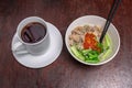 Healthy organic chicken noodles with vegetables and a cup of tea