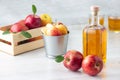 Healthy organic food. Apple cider vinegar or juice in glass bottle and fresh red apples. Royalty Free Stock Photo