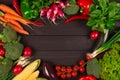 Healthy organic food background. Fresh farm raw vegetables from local farmer market, on black wooden background or table. Royalty Free Stock Photo