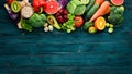 Healthy organic food on a blue wooden background. Vegetables and fruits.