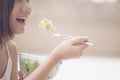 Healthy organic food. Young beautiful woman eating salad Royalty Free Stock Photo