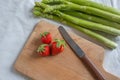 Healthy organic green fresh asparagus with a bunch of healthy strawberries Royalty Free Stock Photo