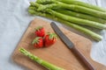 Healthy organic green fresh asparagus with a bunch of healthy strawberries Royalty Free Stock Photo