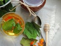 Healthy organic herbal tea with calendula and dry leaves of blackcurrant and mulberry. Royalty Free Stock Photo