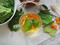 Healthy organic herbal tea with calendula and dry leaves of blackcurrant and mulberry. Royalty Free Stock Photo