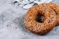 Healthy organic whole grain bagel on concrete table. Breakfast bread. Copy space, top view Royalty Free Stock Photo