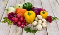 Artistically arranged flowers and vegetables for displaying healthy organic foods