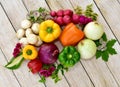 Artistically arranged flowers and vegetables for displaying healthy organic foods