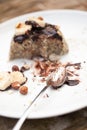 Healthy paleo cake with dark chocolate, banana and hazelnuts