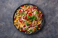 Healthy pasta salad with zucchini sweet corn tomato and basil, vegetarian lunch Royalty Free Stock Photo