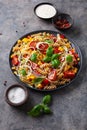 Healthy pasta salad with zucchini sweet corn tomato and basil, vegetarian lunch Royalty Free Stock Photo