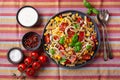 Healthy pasta salad with zucchini sweet corn tomato and basil, vegetarian lunch Royalty Free Stock Photo