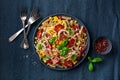 Healthy pasta salad with zucchini sweet corn tomato and basil, vegetarian lunch Royalty Free Stock Photo